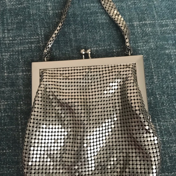 Woman’s silver Whiting and Davis evening bag.
